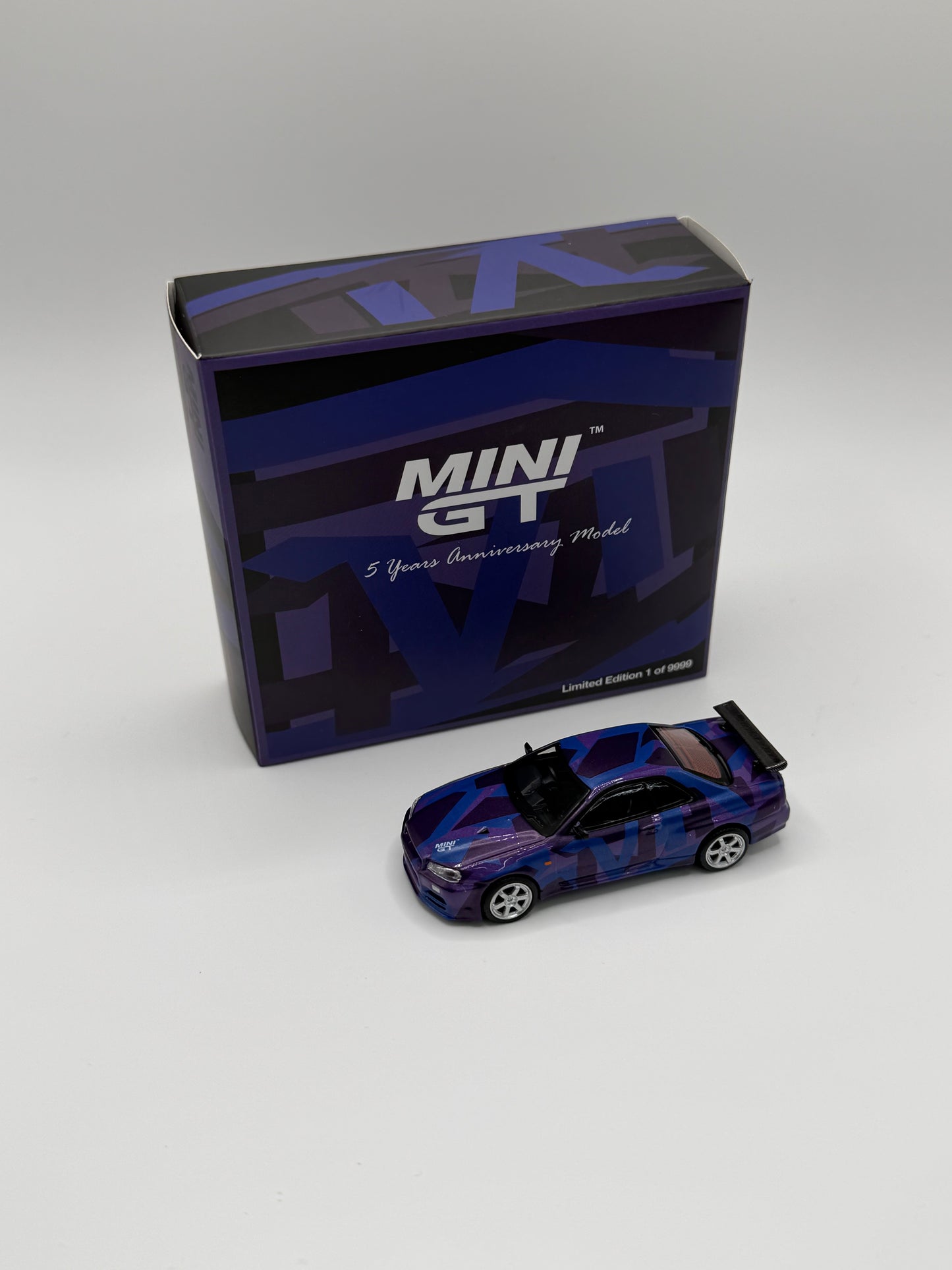 Mini GT #446 Nissan Skyline GTR R34 Digital Camouflage Purple