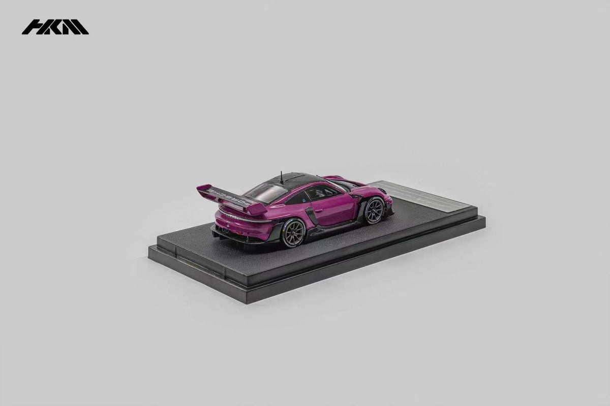 HKM Porsche 911 (992) GT3 R Rennsport in Ruby Star — rear view