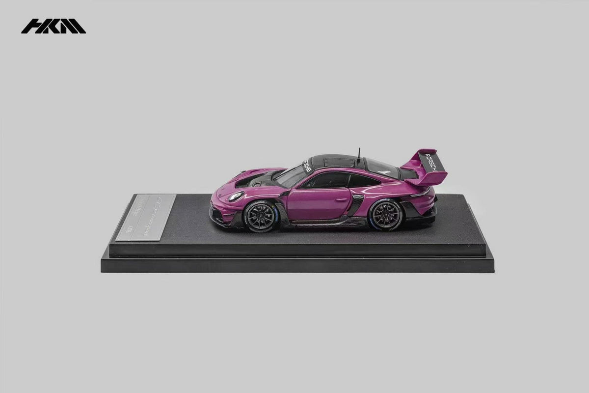 HKM Porsche 911 (992) GT3 R Rennsport in Ruby Star — side view