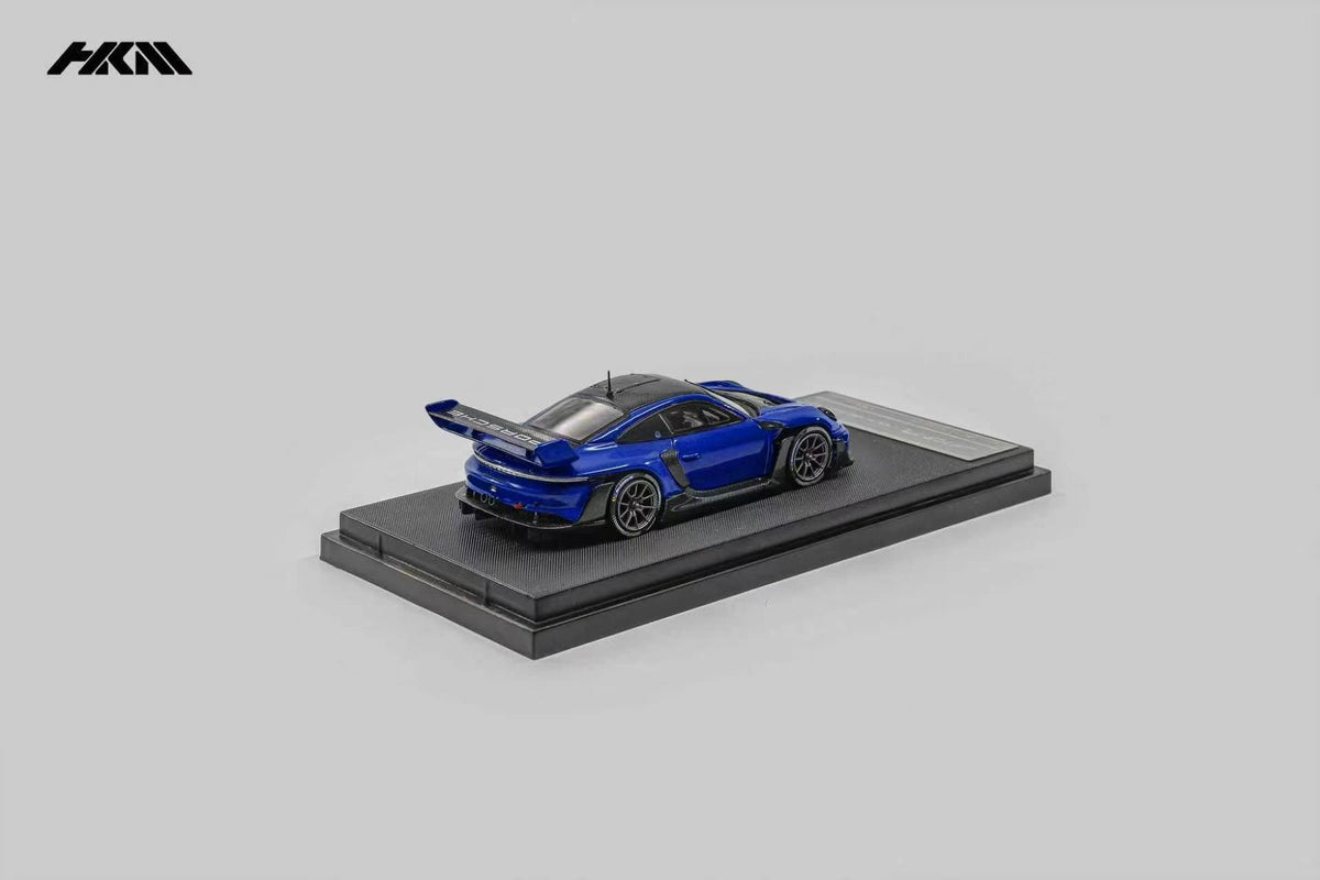 HKM Porsche 911 (992) GT3 R Rennsport in Sanmarino Blue Metallic — rear view